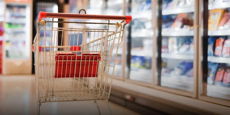 A shopping trolley in a supermarket aisle